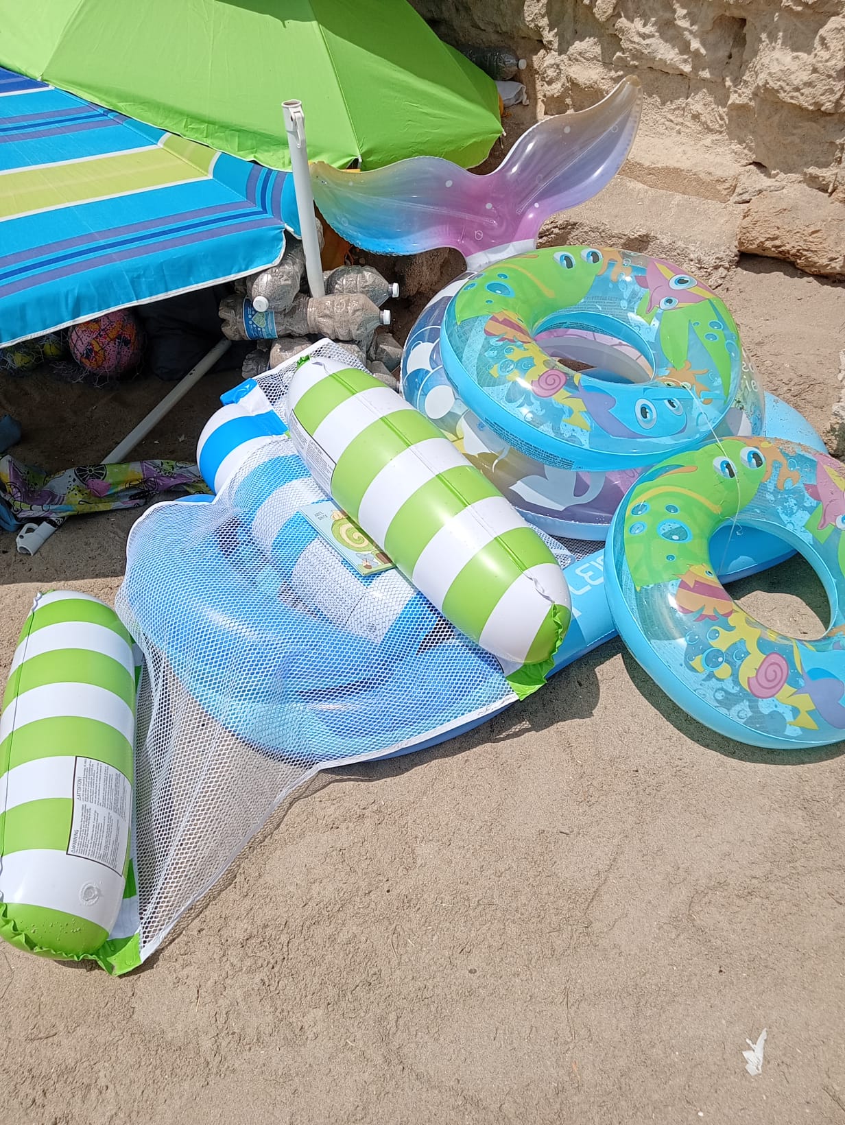 Beach umbrellas, sunbeds, towels, inflatables and beach games sold by Aziz in Gallipoli