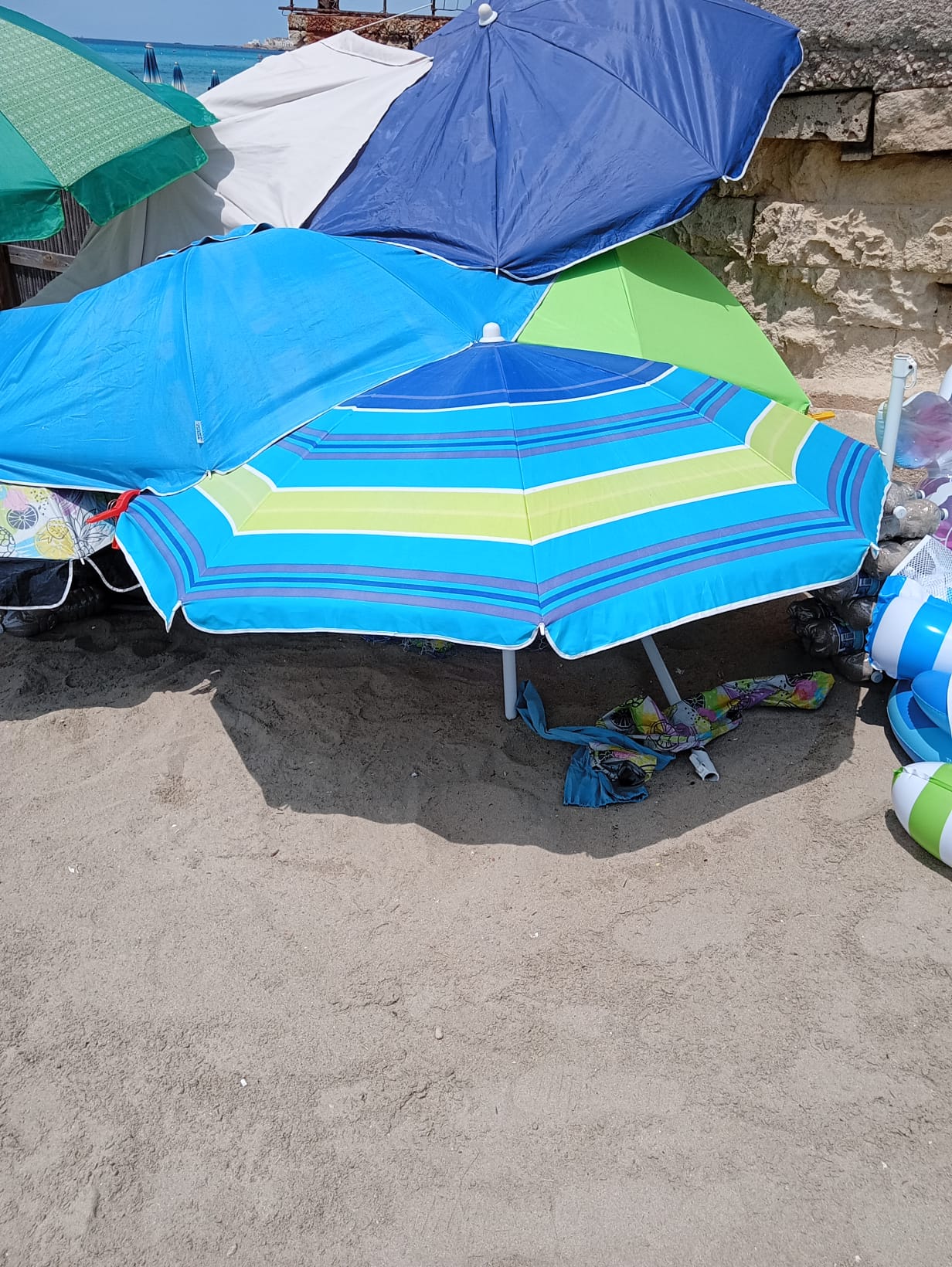 Beach umbrellas, sunbeds, towels, inflatables and beach games sold by Aziz in Gallipoli