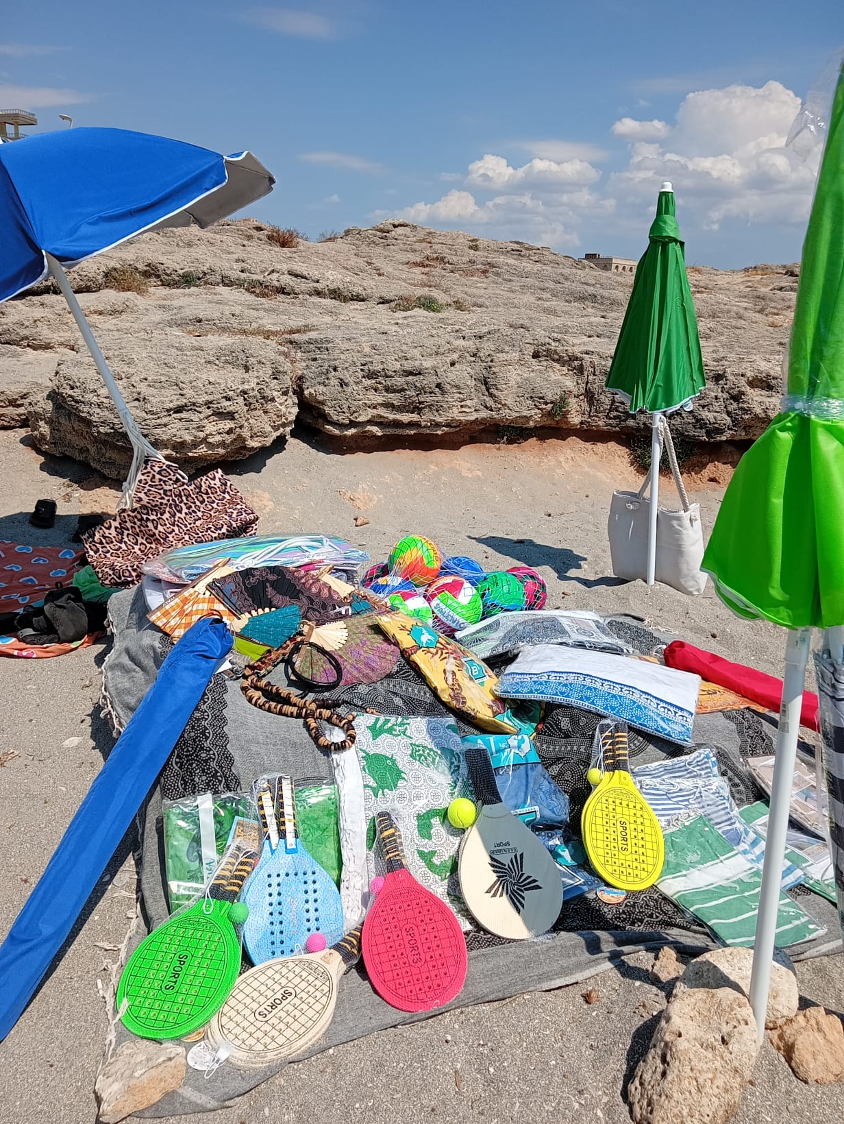 Beach umbrellas, sunbeds, towels, inflatables and beach games sold by Aziz in Gallipoli